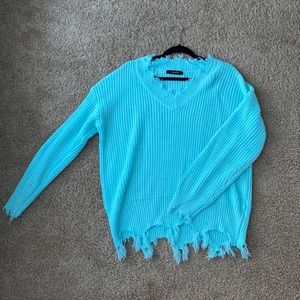 Blue, distressed sweater